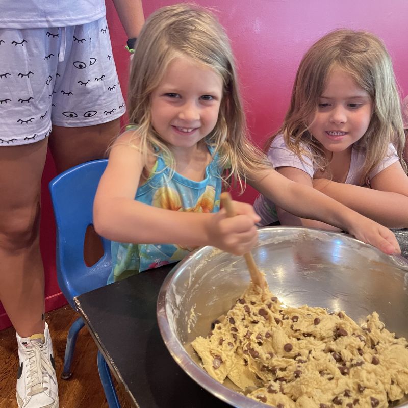 counselor and campers in arts and crafts