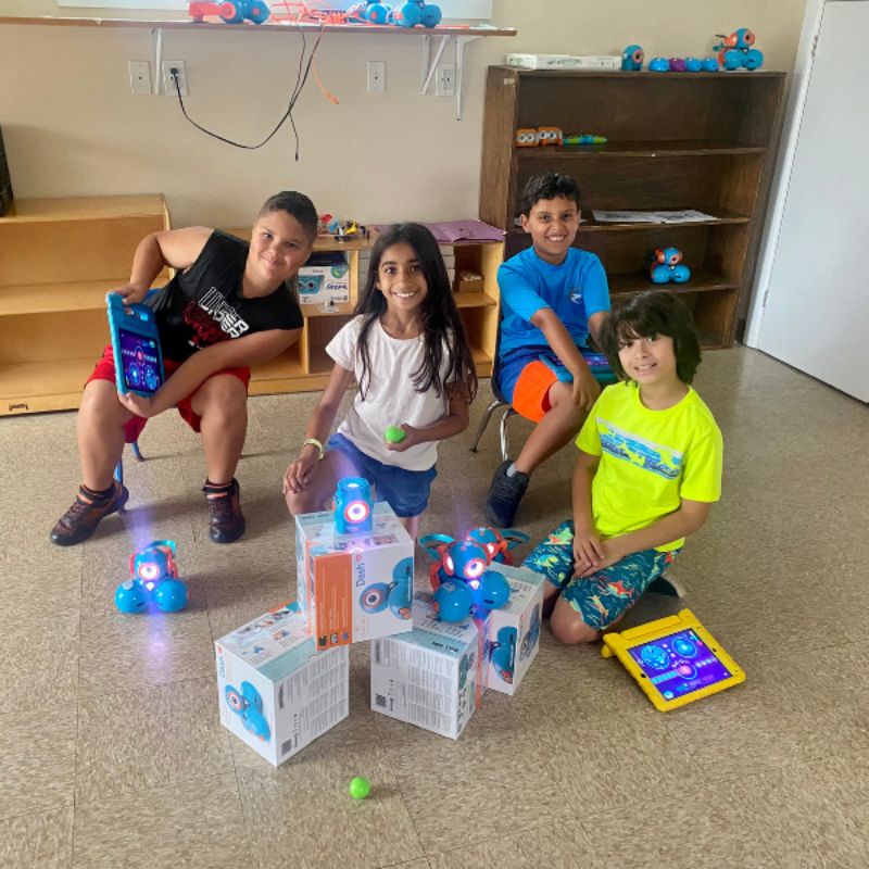 Extreme STEAM Science Kids campers with DASH robots